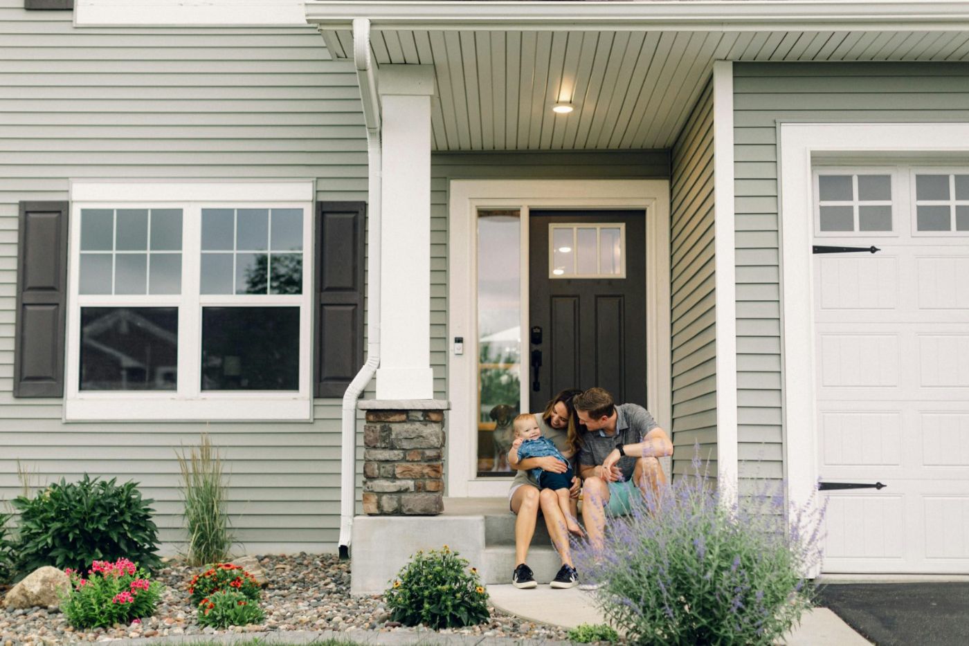 Family at the front door of their first Las Vegas home bought with an FHA loan